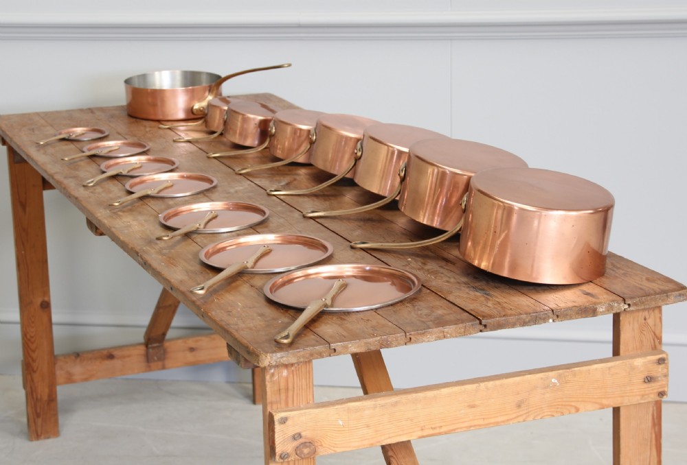 A collection of 19th century copper saucepans  View II