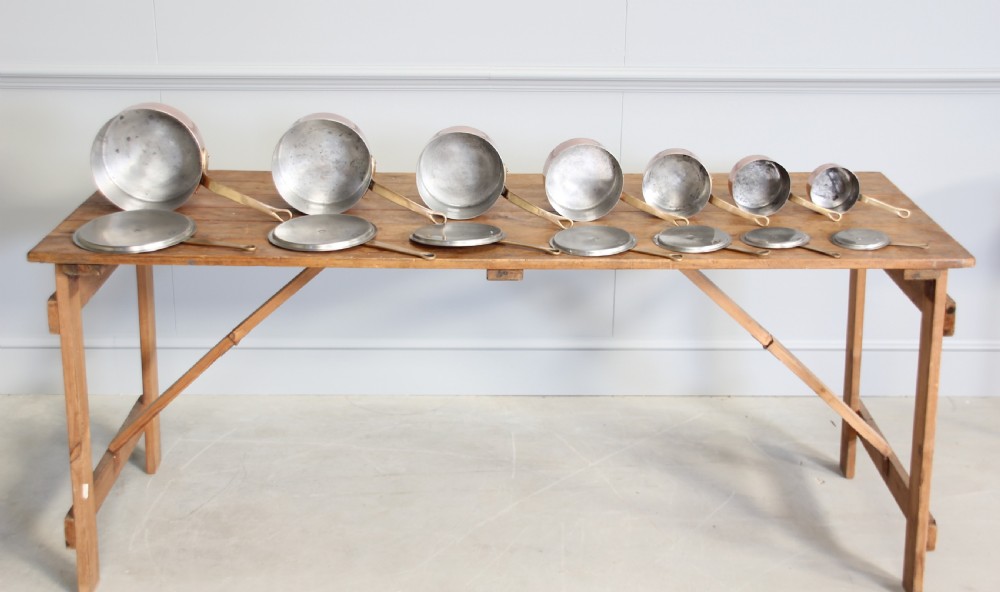 A collection of 19th century copper saucepans  View VI