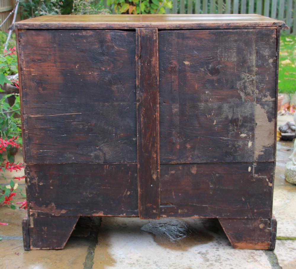 An early 18th century walnut kneehole desk. View VIII