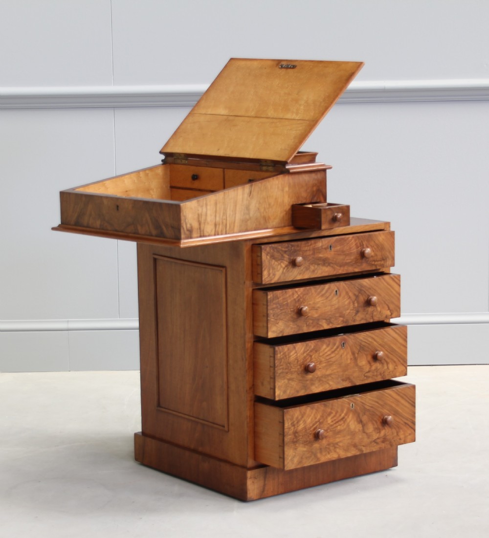 A Victorian burr walnut davenport. View II