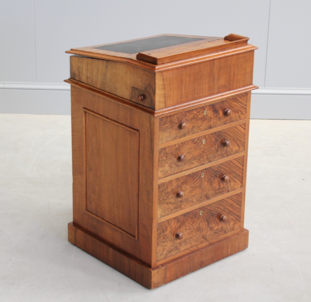 A Victorian burr walnut davenport. View IV