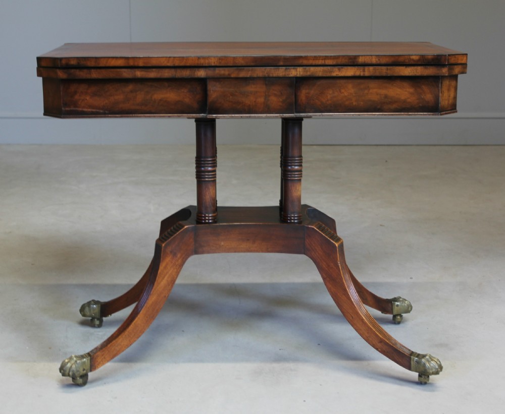 A REGENCY MAHOGANY CARD TABLE.