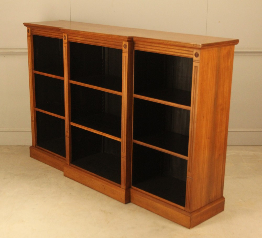 A pair of Edwardian mahogany low open breakfront bookcases featuring three bays and plinth bases. View VII