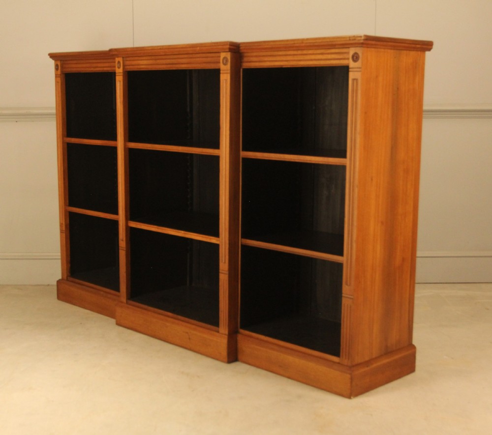 A pair of Edwardian mahogany low open breakfront bookcases featuring three bays and plinth bases. View VIII