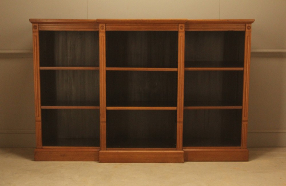 A pair of Edwardian mahogany low open breakfront bookcases featuring three bays and plinth bases. View XIII