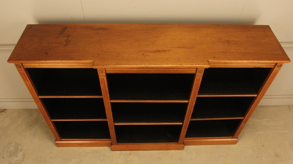 A pair of Edwardian mahogany low open breakfront bookcases featuring three bays and plinth bases. View XIV