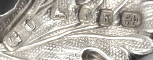 fig 1. A Victorian sterling silver decanter label shaped as a vine leaf engraved with MADEIRA attached to a fine chain.