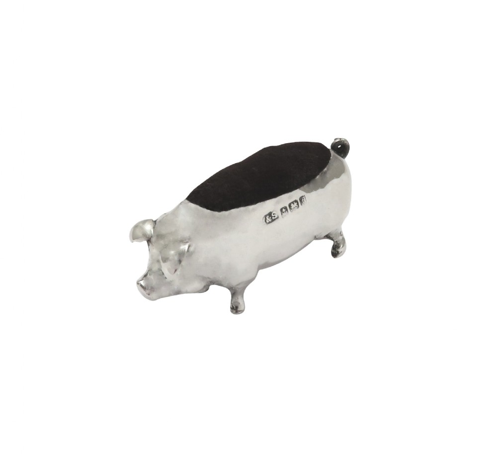 An Edwardian sterling silver novelty pin cushion modelled in the form of a pig with a dark velvet inset cushion along its back. View VII