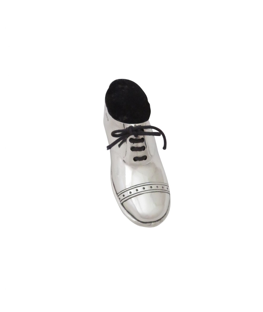 An Edwardian sterling silver pin cushion crafted in the shape of a shoe with a black velvet pad and fabric laces. View VII