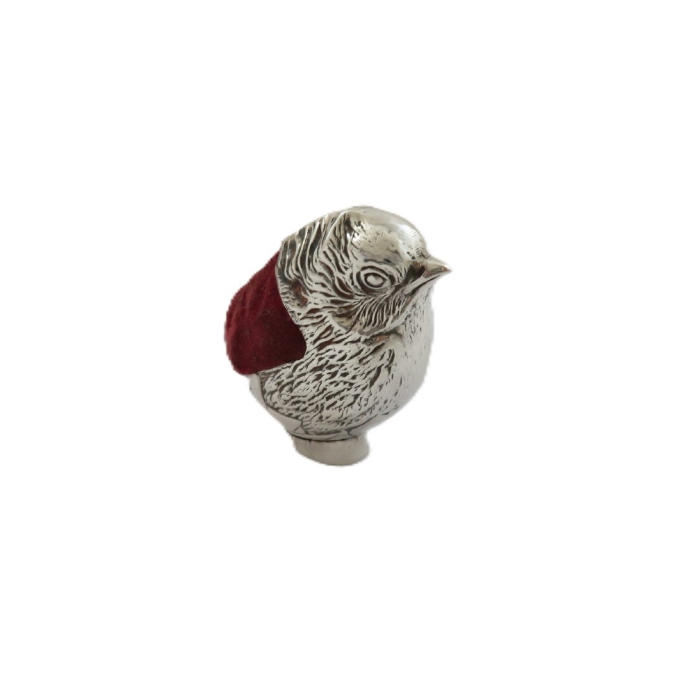 An Edwardian sterling silver novelty pin cushion cast in the form of a small chick with detailed feathers and a red velvet insert. View III