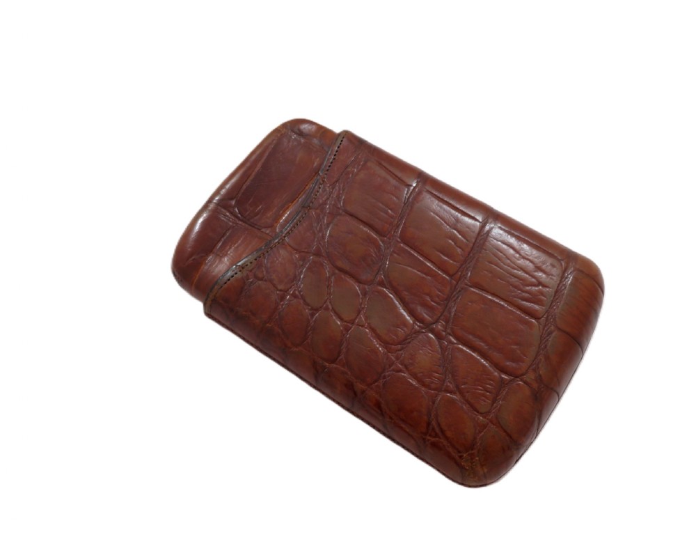 An antique Victorian warm brown crocodile leather pocket cigar case featuring a textured hide exterior and telescopic sleeve design. View V