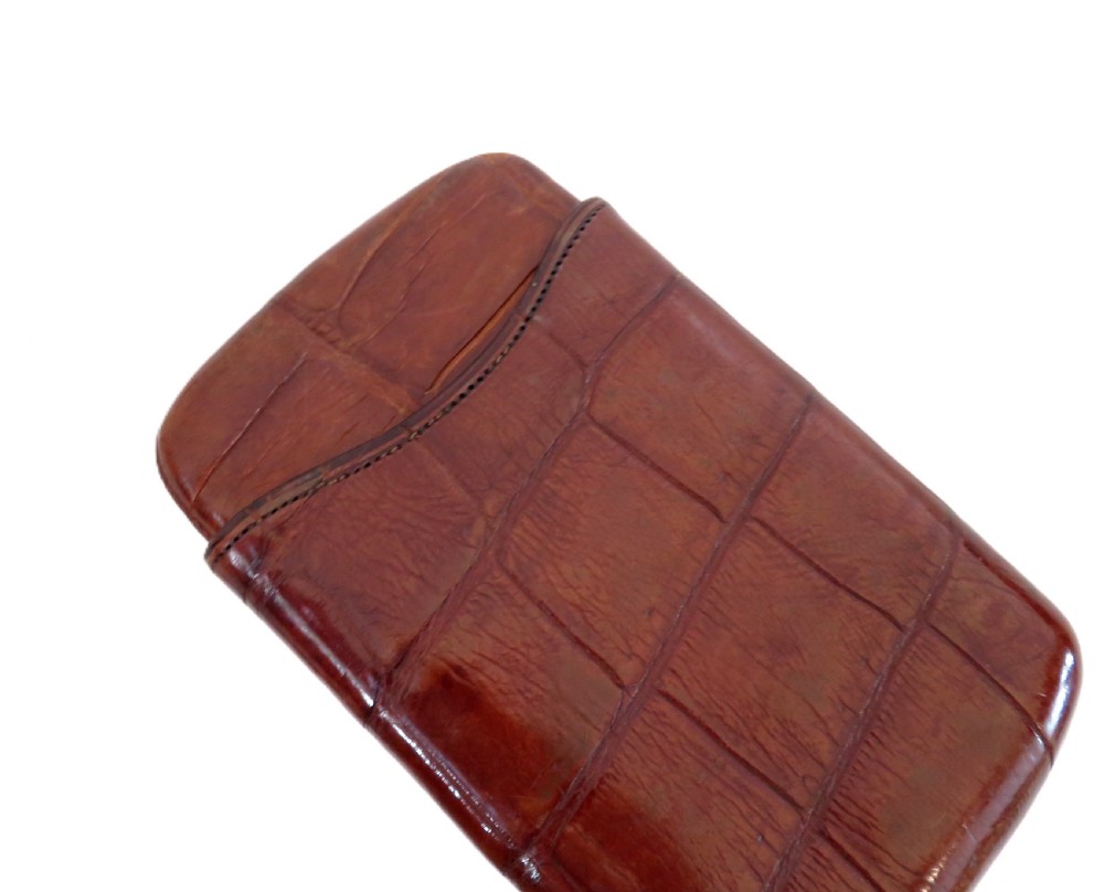 An antique Victorian warm brown crocodile leather pocket cigar case featuring a textured hide exterior and telescopic sleeve design. View VI