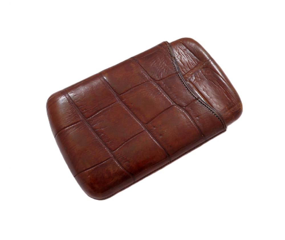 An antique Victorian warm brown crocodile leather pocket cigar case featuring a textured hide exterior and telescopic sleeve design. View VII