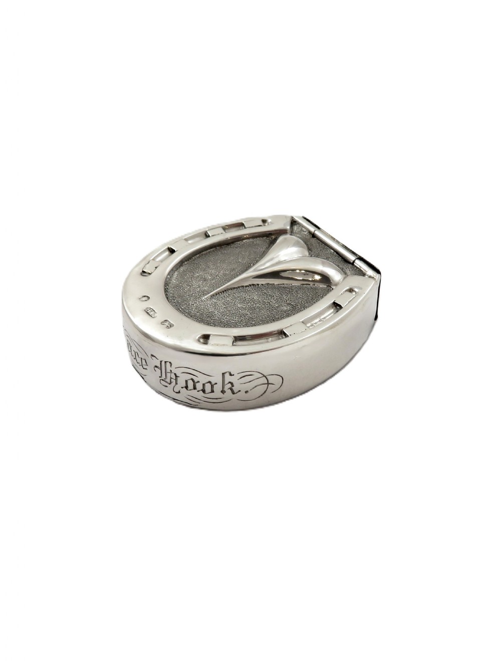 A Victorian sterling silver vesta case in the shape of a horseshoe featuring textured detailing and engraved lettering. View X