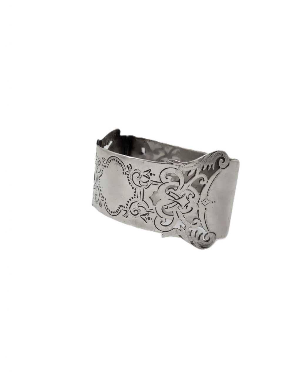 An engraved sterling silver napkin ring resting inside an open red leather presentation case lined with dark red velvet and cream silk. View VI
