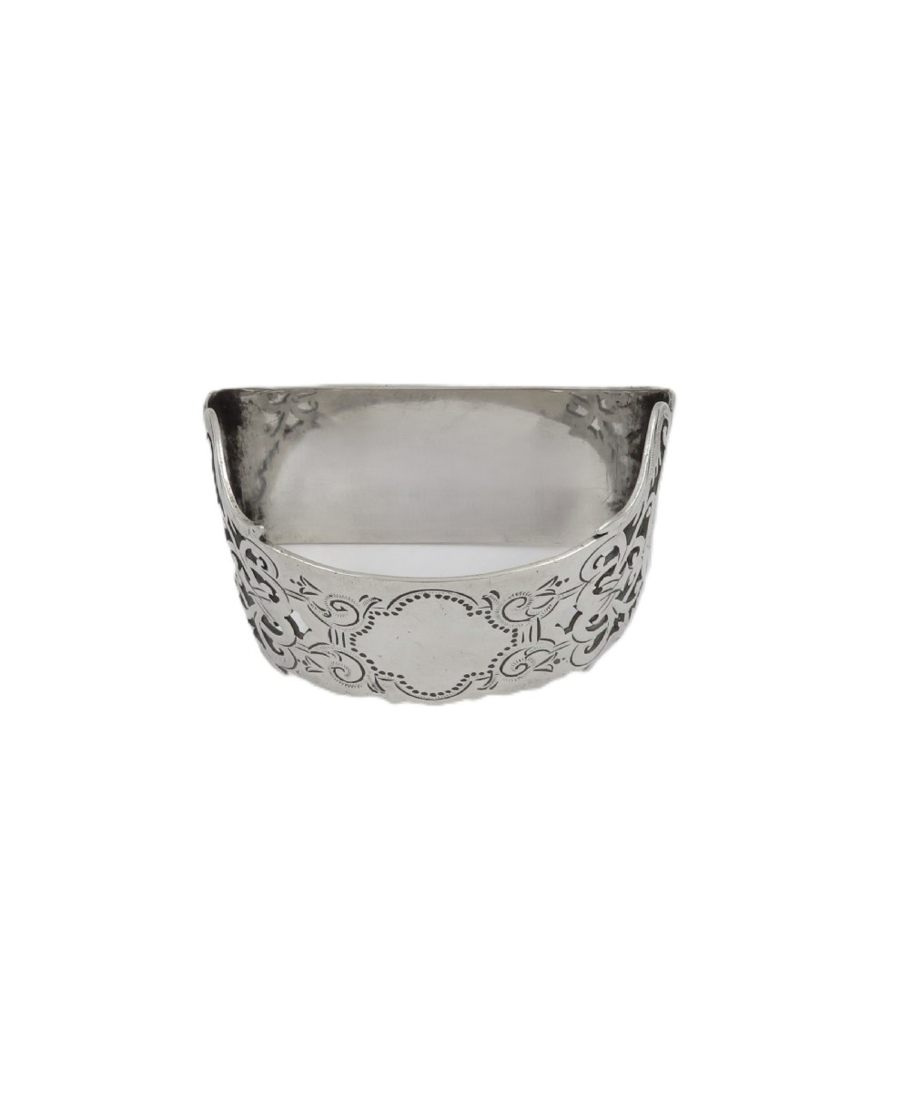 An engraved sterling silver napkin ring resting inside an open red leather presentation case lined with dark red velvet and cream silk. View VIII