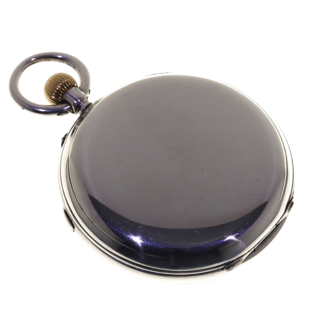An antique silver open-face chronograph pocket watch featuring a white enamel dial with black Roman numerals and a brass winding crown. View II