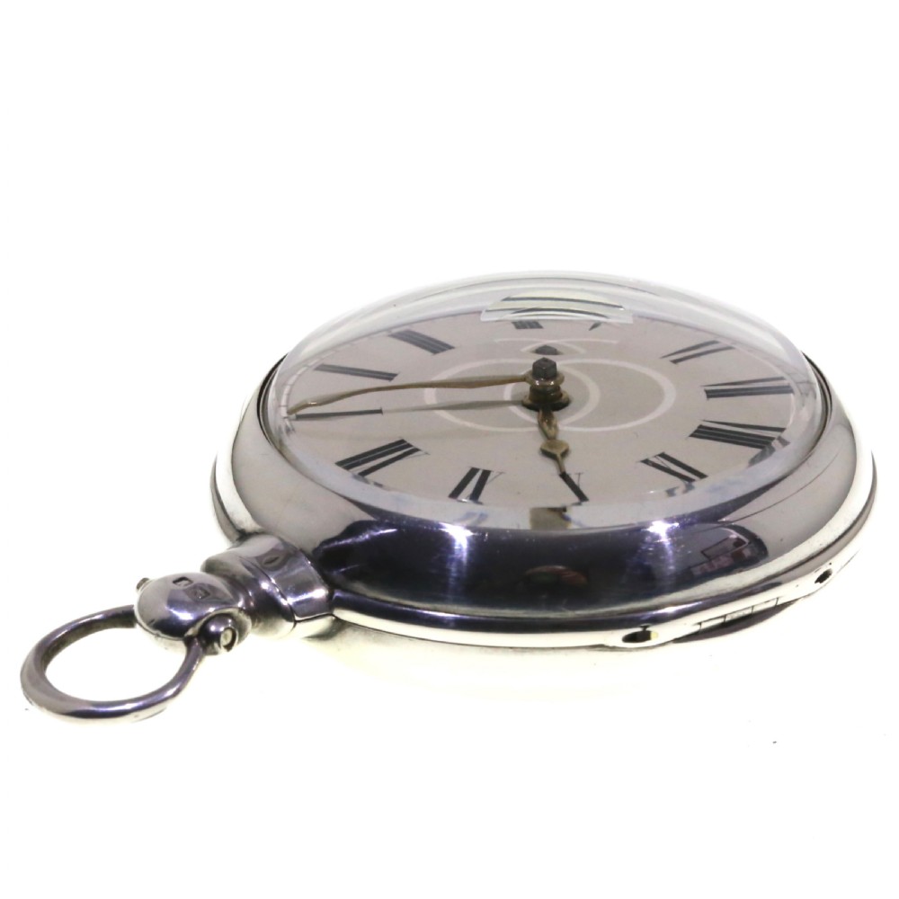 A Victorian silver verge pair cased pocket watch with a white dial and black Roman numerals. View VI