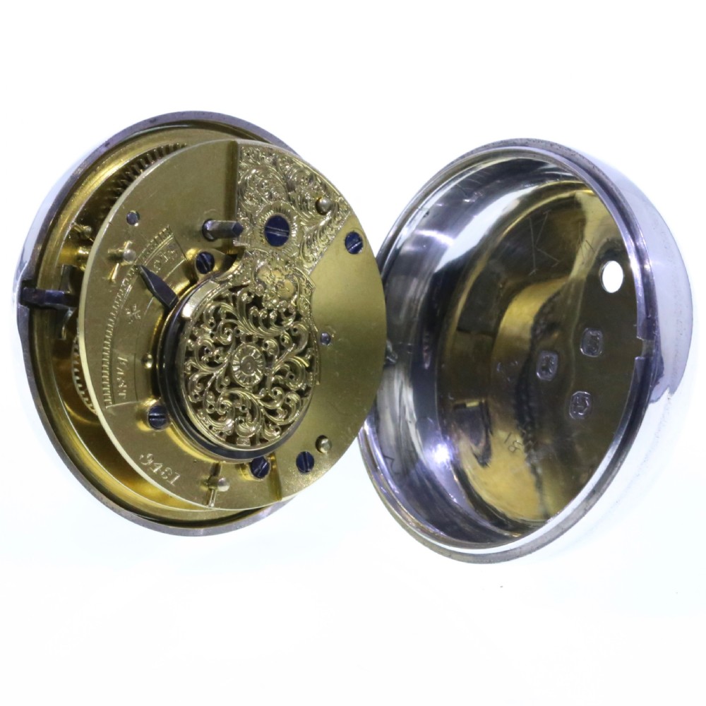 A Victorian silver verge pair cased pocket watch with a white dial and black Roman numerals. View X