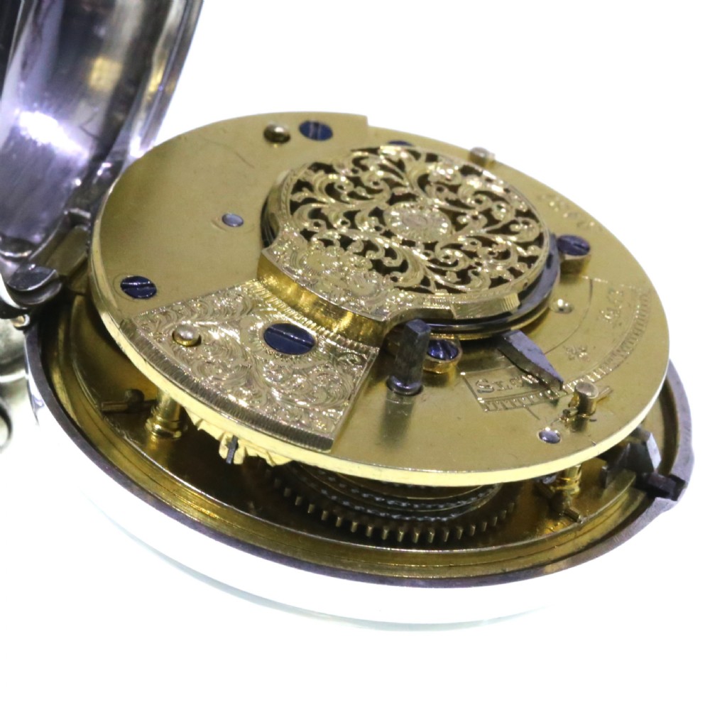 A Victorian silver verge pair cased pocket watch with a white dial and black Roman numerals. View XI