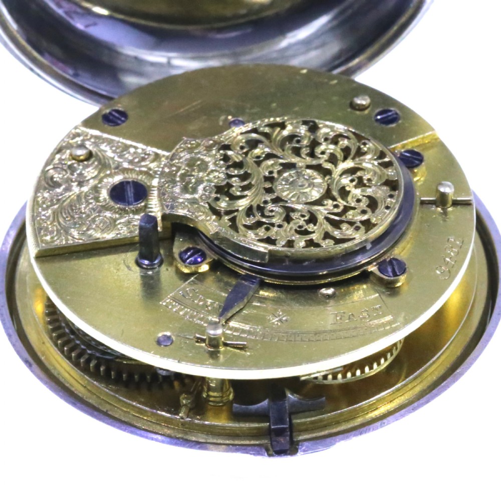 A Victorian silver verge pair cased pocket watch with a white dial and black Roman numerals. View XII