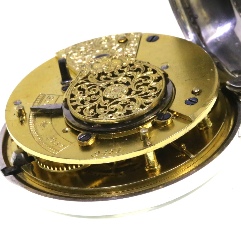 A Victorian silver verge pair cased pocket watch with a white dial and black Roman numerals. View XIII