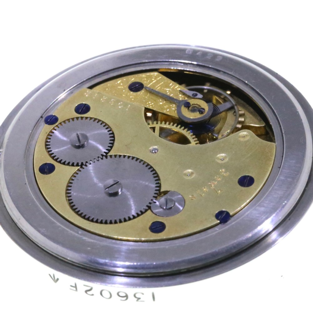 A circular silver-tone military keyless pocket watch with a white enamel dial, black Roman numerals, and a subsidiary seconds sub-dial. View IV
