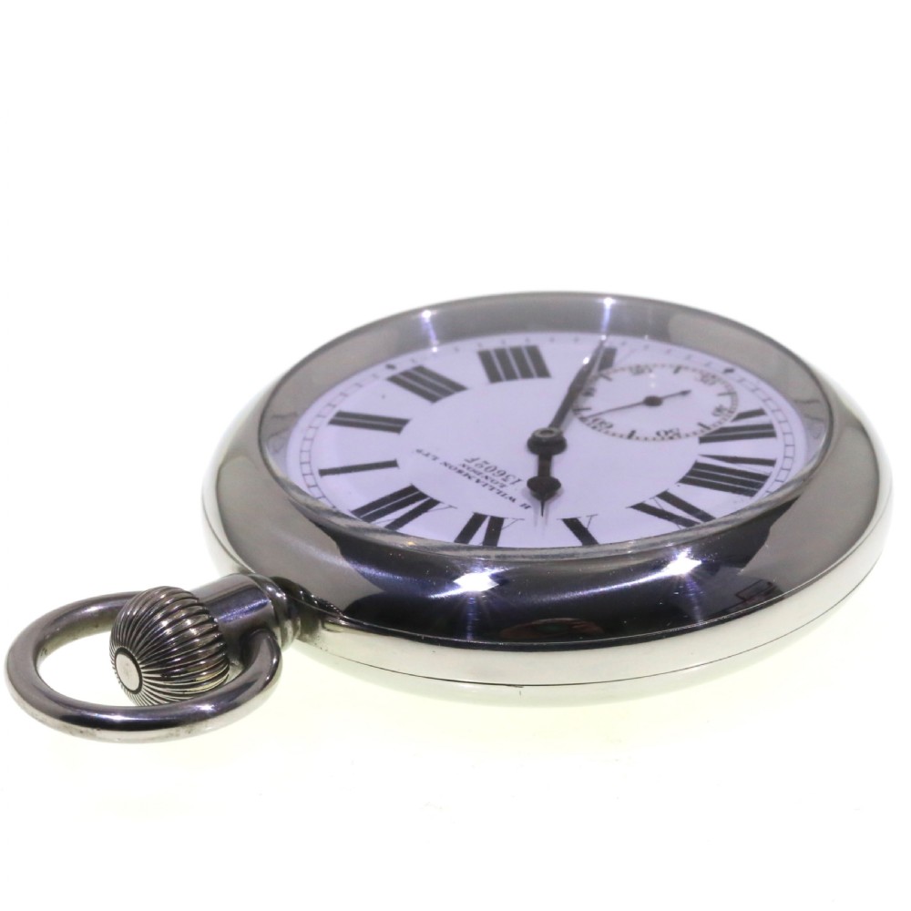 A circular silver-tone military keyless pocket watch with a white enamel dial, black Roman numerals, and a subsidiary seconds sub-dial. View VII