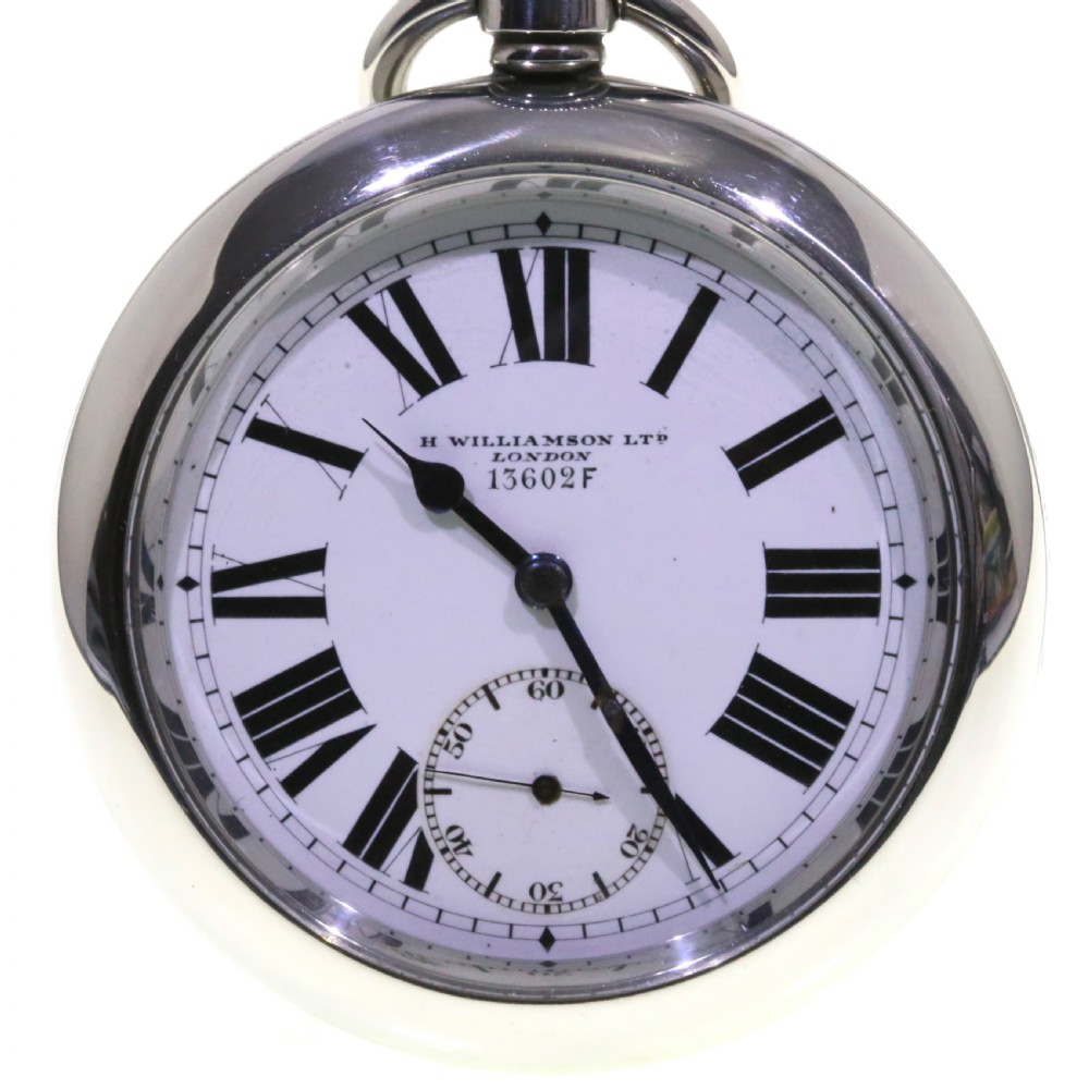 A circular silver-tone military keyless pocket watch with a white enamel dial, black Roman numerals, and a subsidiary seconds sub-dial. View XI