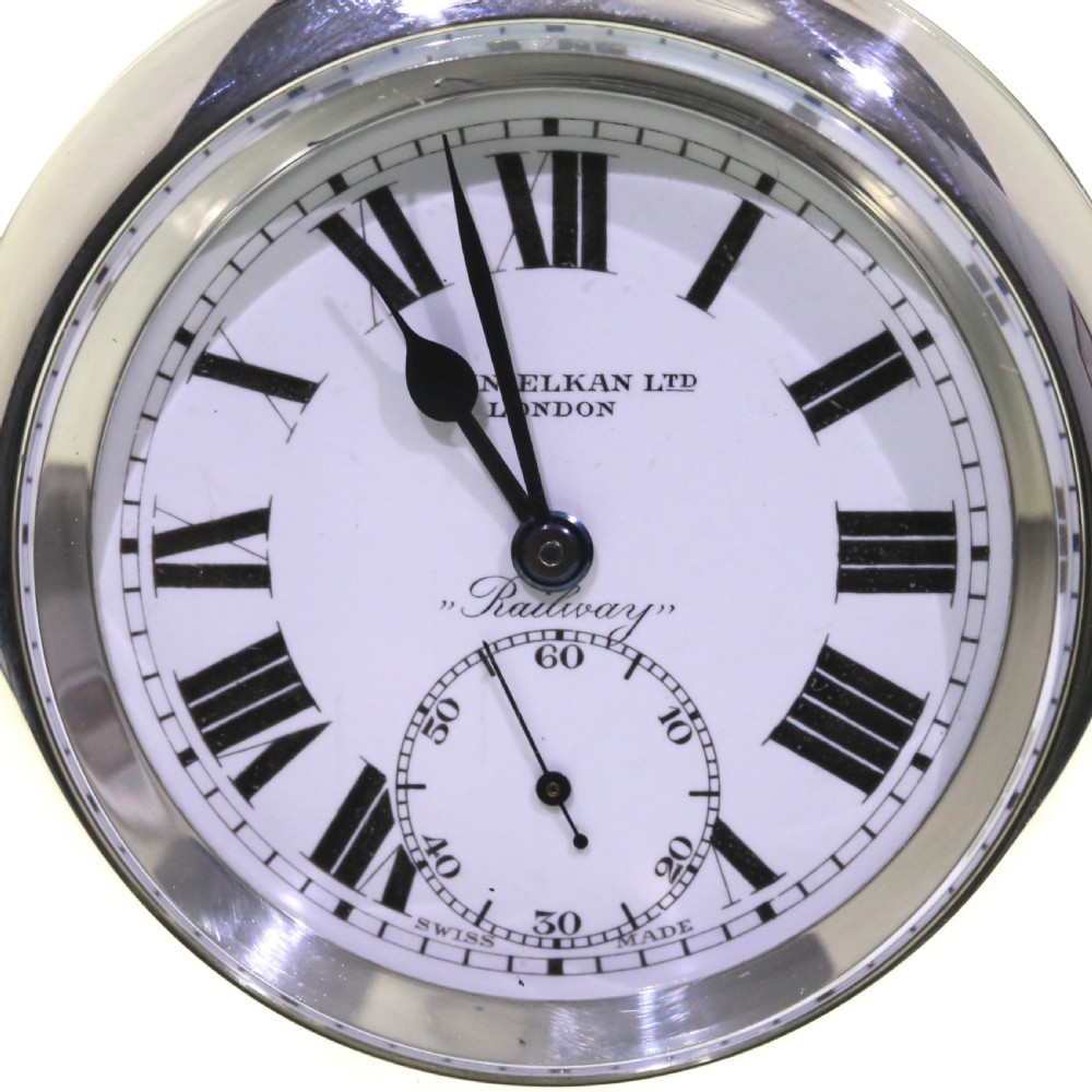 An open-face silver pocket watch featuring a white enamel dial with black Roman numerals, spade hands, and a sub-seconds dial. View IV