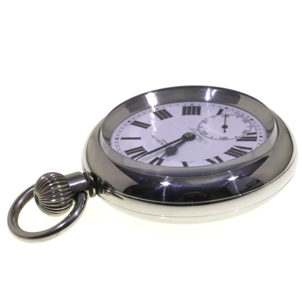 An open-face silver pocket watch featuring a white enamel dial with black Roman numerals, spade hands, and a sub-seconds dial. View X