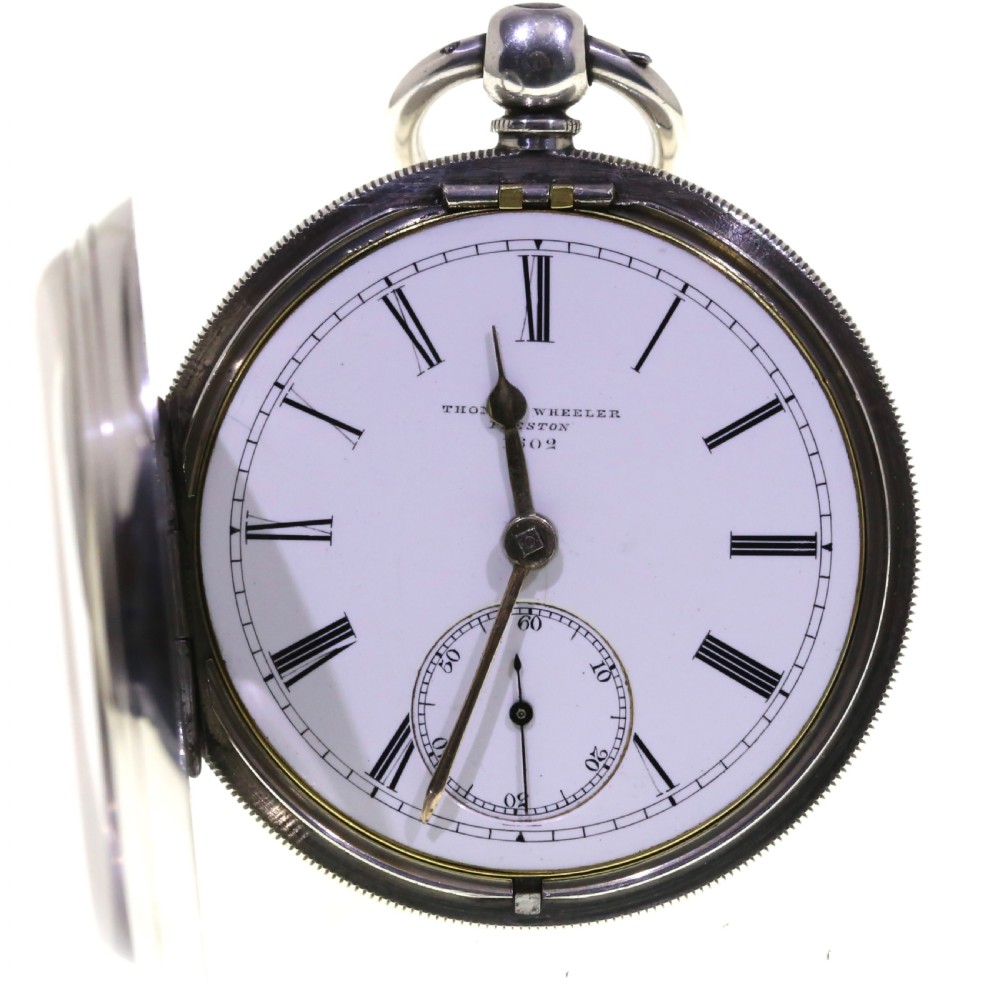 A Victorian silver pocket watch displaying a white enamel dial with black Roman numerals, dark steel hands, a subsidiary seconds dial, and an attached silver hanging loop. View II