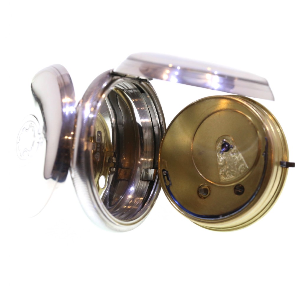 A Victorian silver pocket watch displaying a white enamel dial with black Roman numerals, dark steel hands, a subsidiary seconds dial, and an attached silver hanging loop. View V