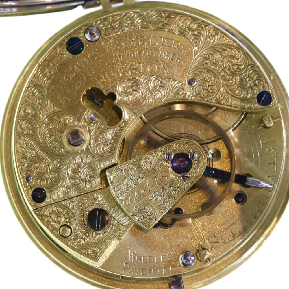 A Victorian silver pocket watch displaying a white enamel dial with black Roman numerals, dark steel hands, a subsidiary seconds dial, and an attached silver hanging loop. View VI