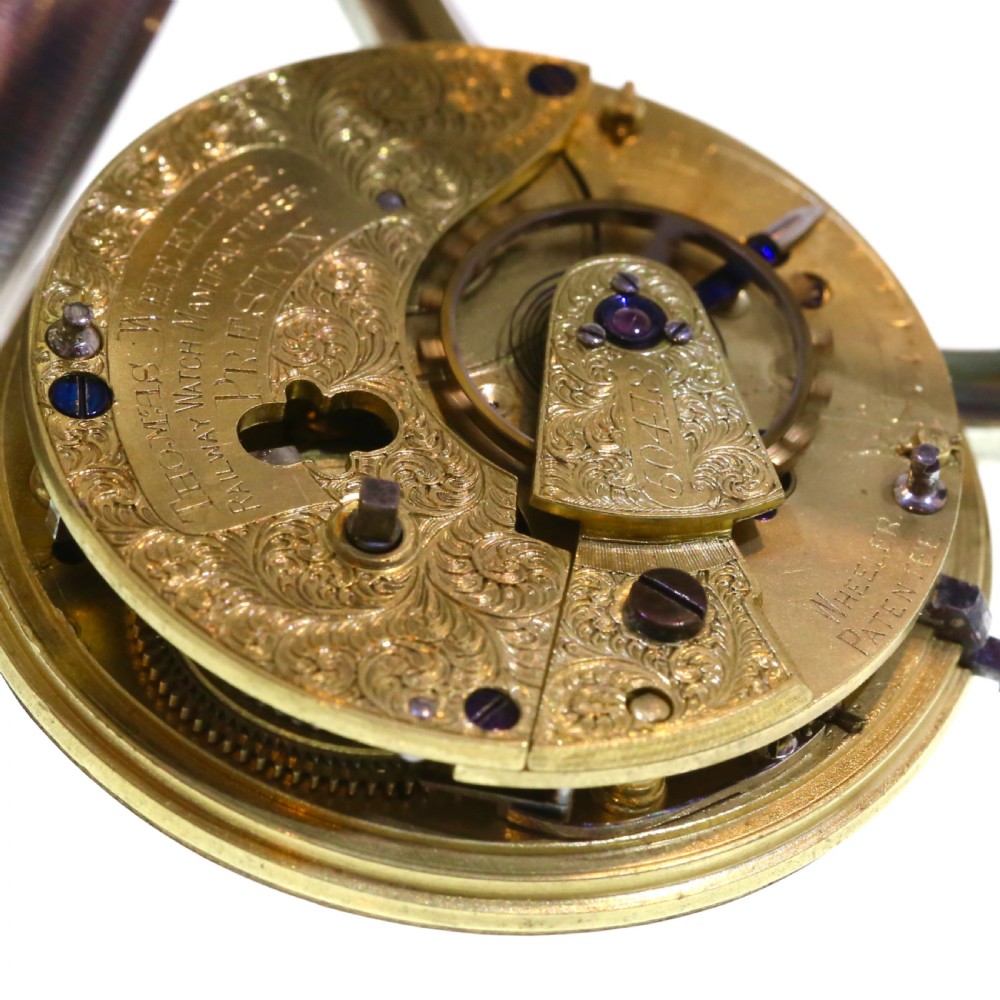 A Victorian silver pocket watch displaying a white enamel dial with black Roman numerals, dark steel hands, a subsidiary seconds dial, and an attached silver hanging loop. View IX