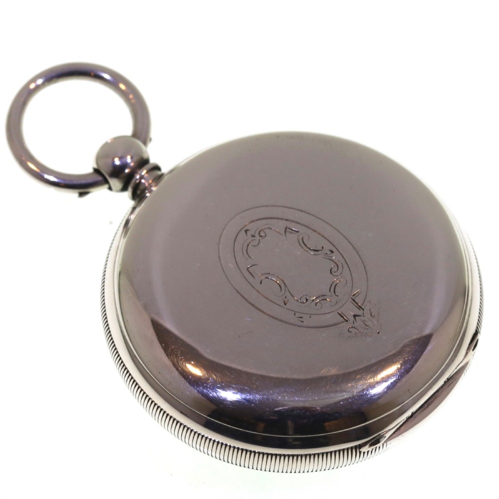 A Victorian silver pocket watch displaying a white enamel dial with black Roman numerals, dark steel hands, a subsidiary seconds dial, and an attached silver hanging loop. View XIV