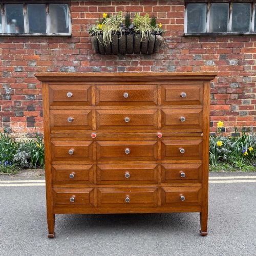 a fifteen drawer oak chest - CATEGORY: ANTIQUE CHEST OF DRAWERS - DATED 1910