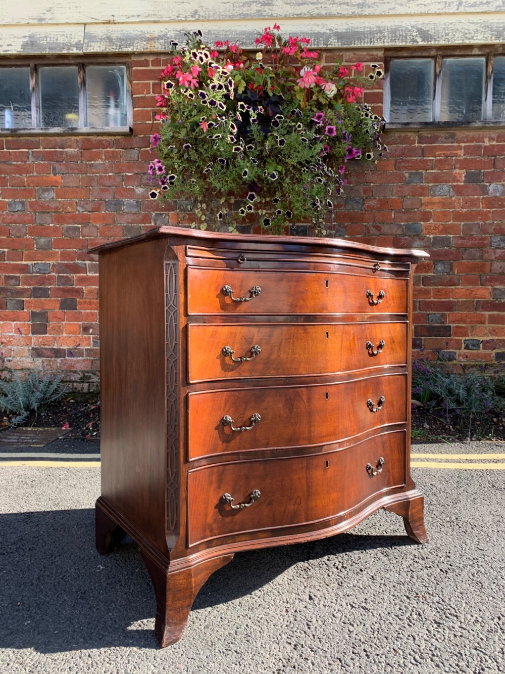 Chippendale revival serpentine chest 