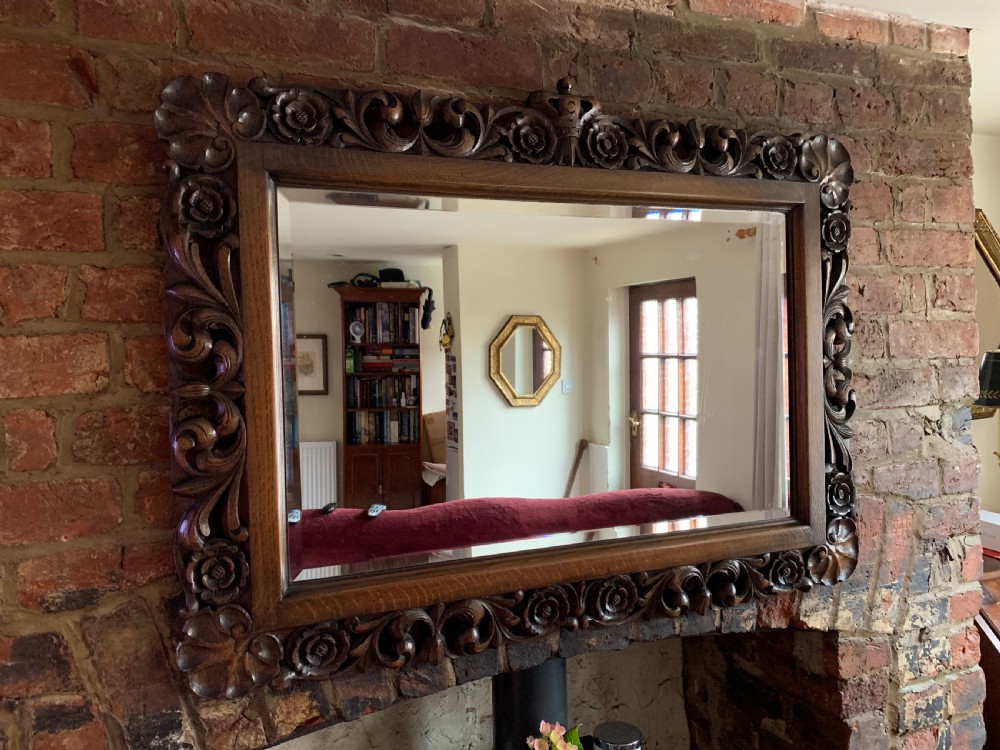 Carved oak overmantle mirror 