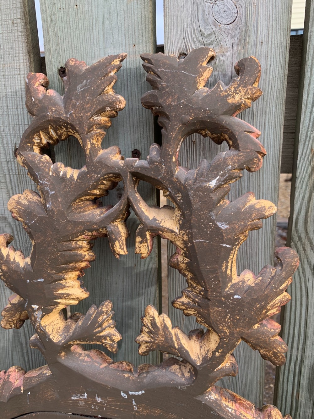 A pair of oval wall mirrors featuring ornate carved wooden frames with oak leaf motifs and ribbon crests in a painted finish. View VII