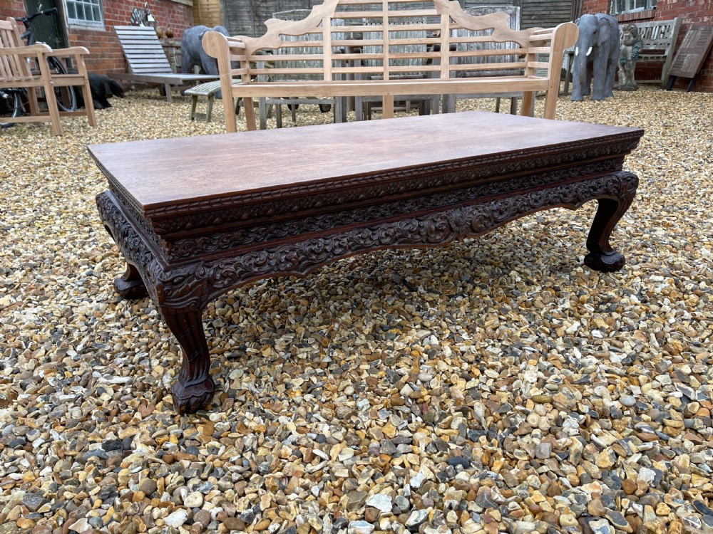Carved teak coffee table 
