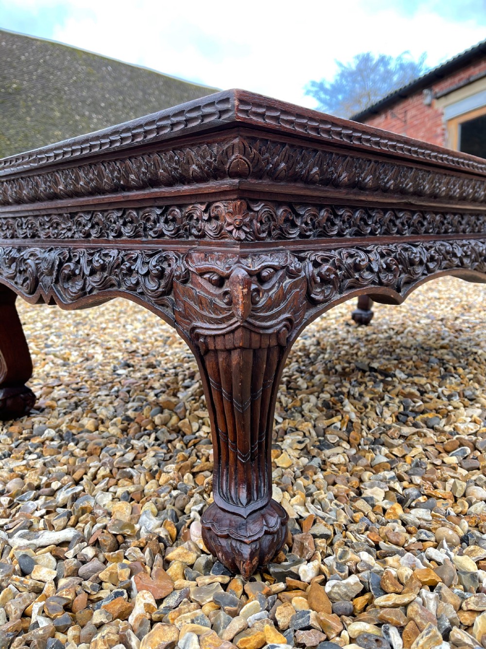 Carved teak coffee table  View III