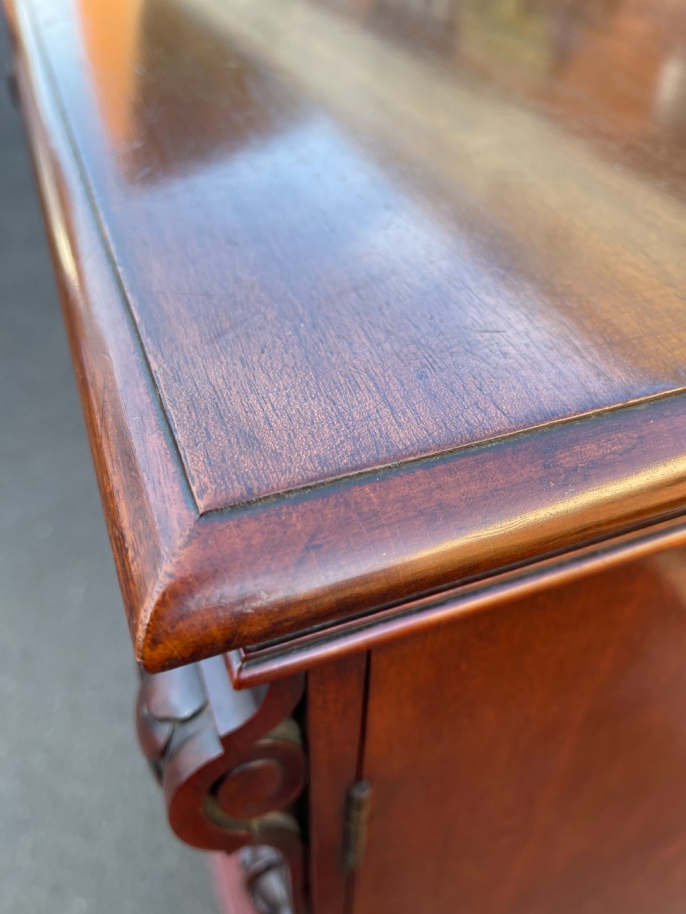 A tall Victorian mahogany Wellington chest featuring seven graduated drawers with turned wooden knobs, carved side corbels, and a side locking pilaster. View V