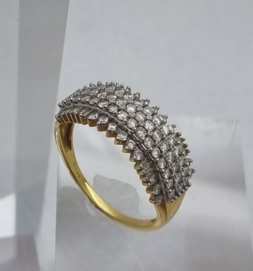 fig 1. An 18ct yellow gold dress ring set with multiple rows of round brilliant diamonds across the upper band.