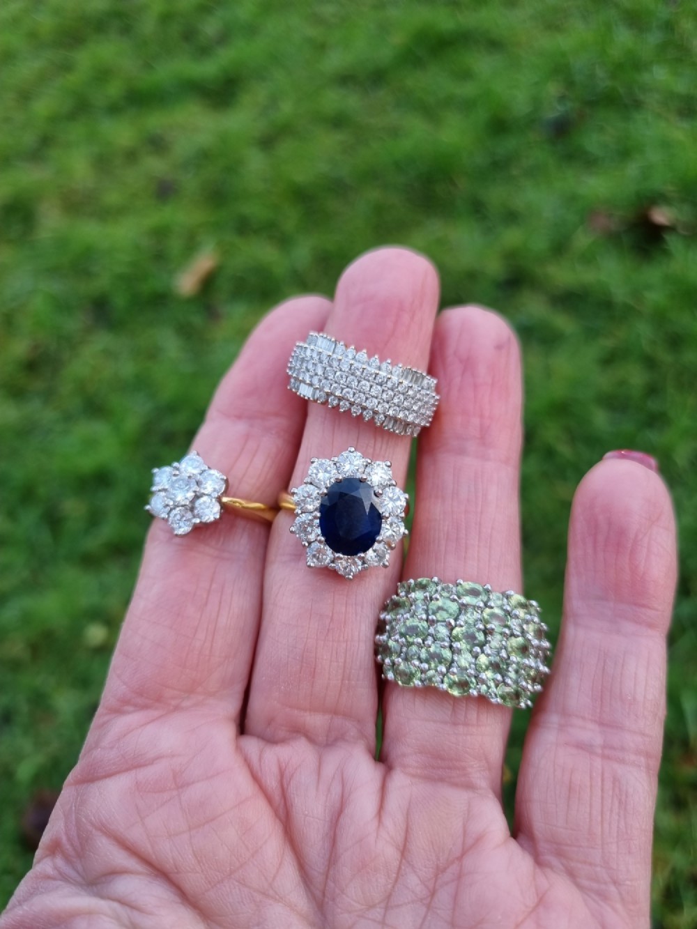 An 18ct yellow gold dress ring set with multiple rows of round brilliant diamonds across the upper band. View IV