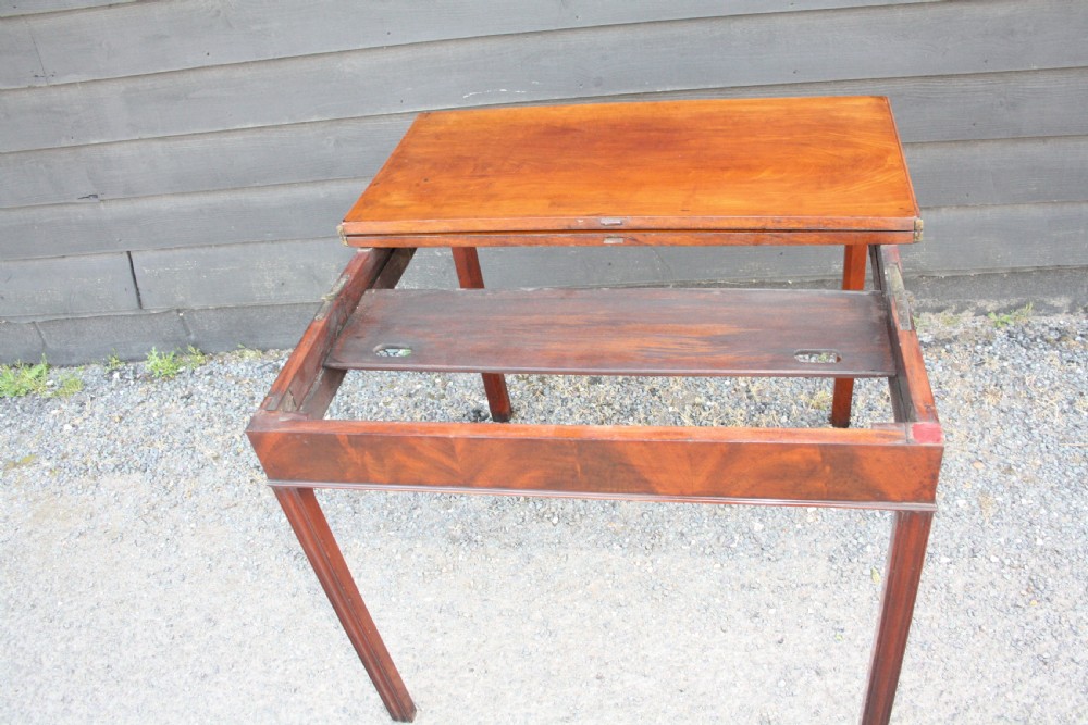 Georgian mahogany tea table With scissor action legs Mechanism. View VII