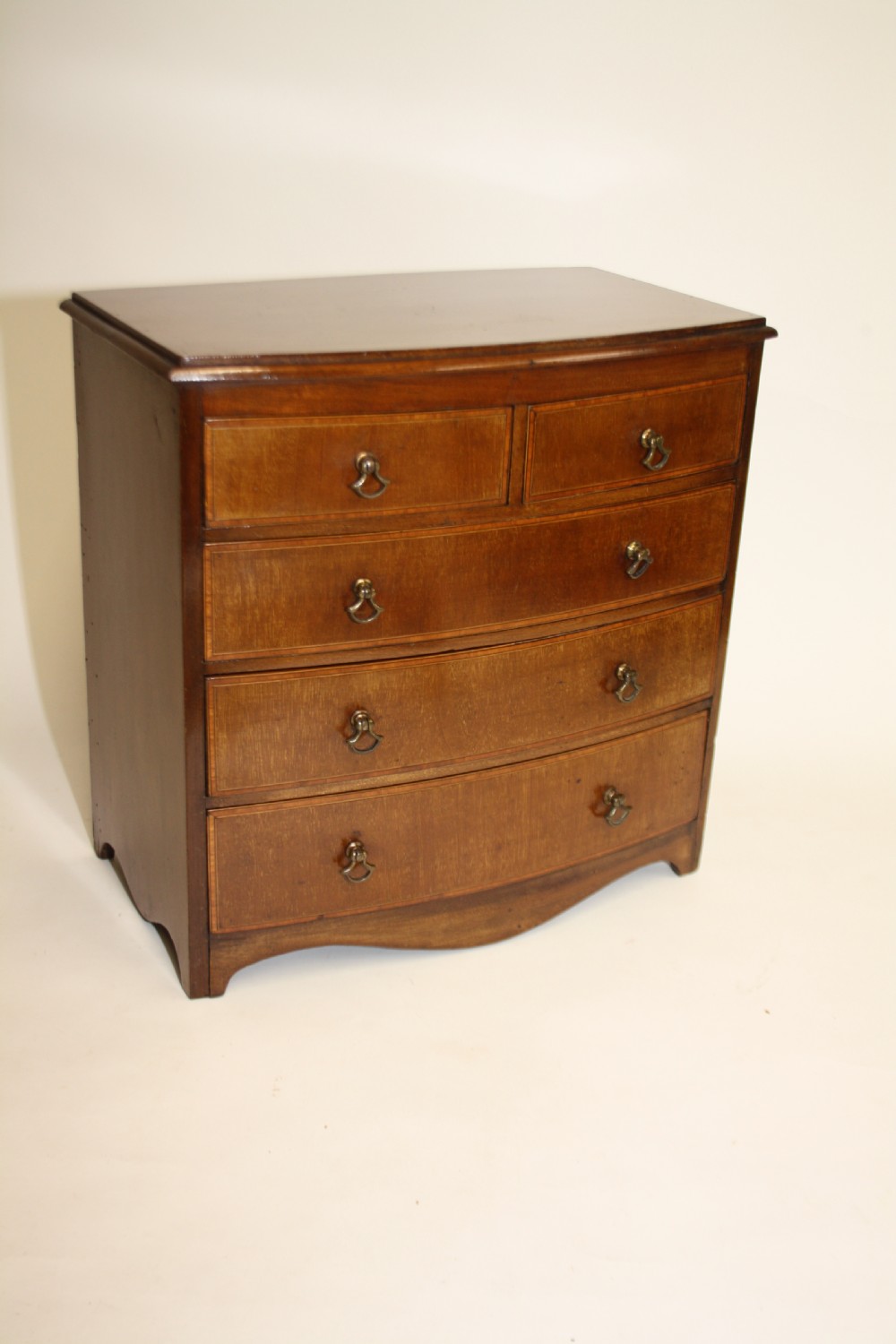 Late 19th century bow front miniature chest of drawers