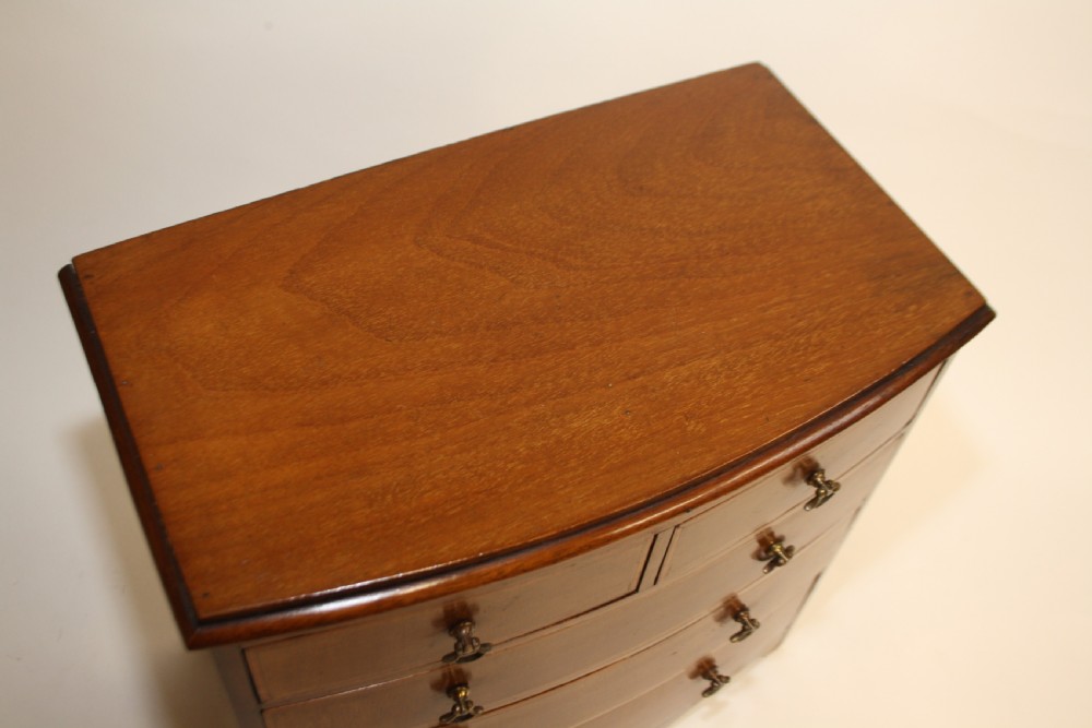 Late 19th century bow front miniature chest of drawers View IV