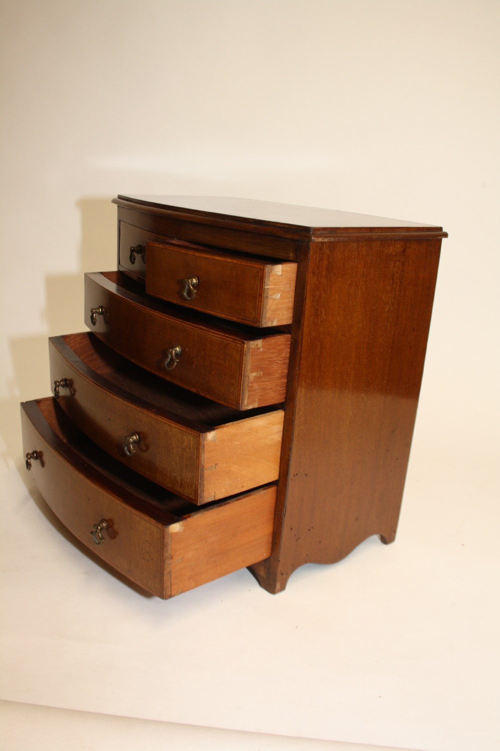 Late 19th century bow front miniature chest of drawers View VIII