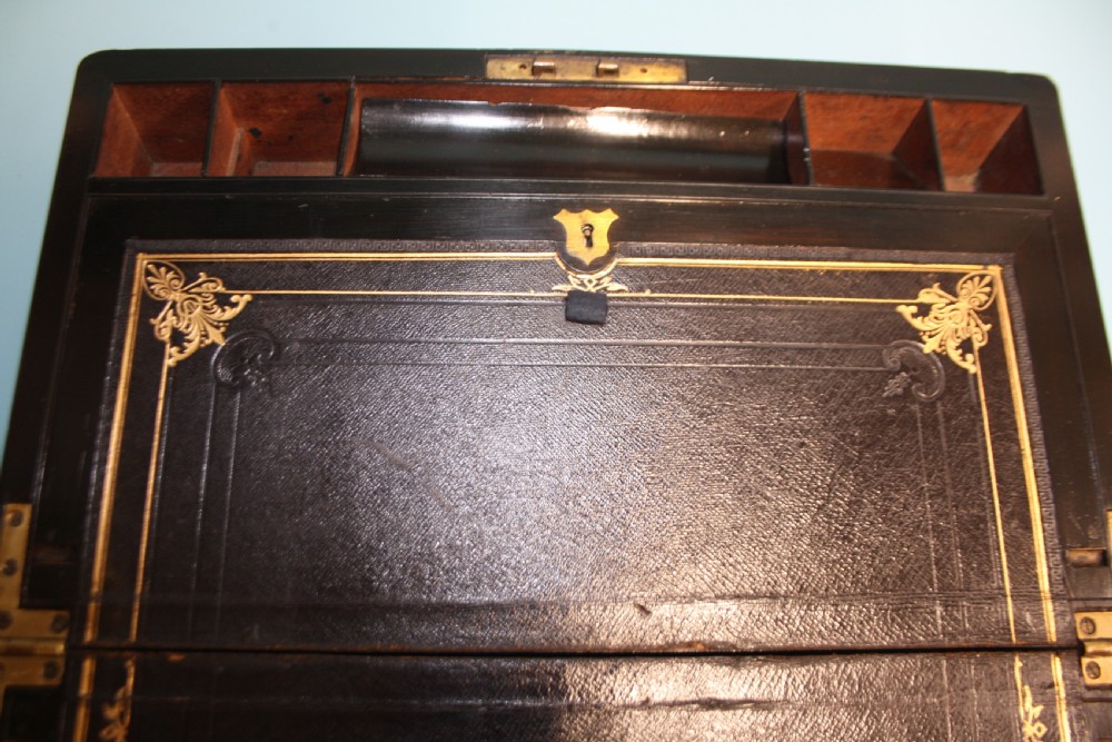 19th-century coromandel writing slope bound in brass with secret drawers View XVII
